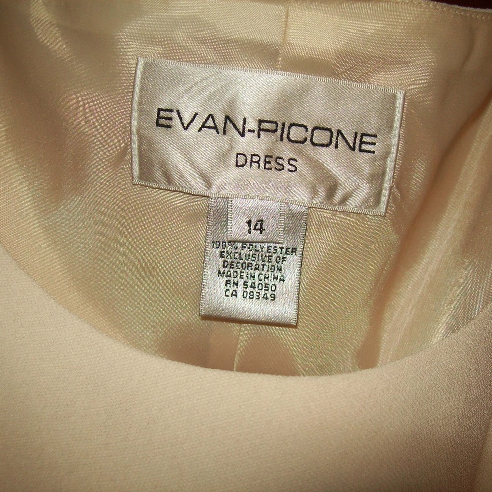 Dress - with accented hip line. Adorned with beads